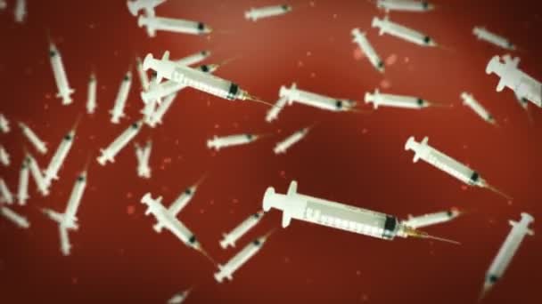 Syringe against dark red — Stock Video