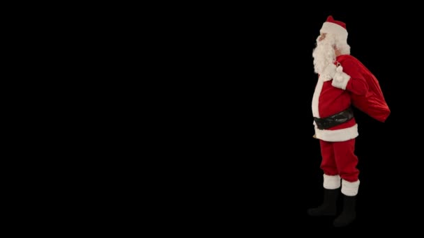 Santa claus, agitant une cloche avec un espace pour le texte, contre black — Video