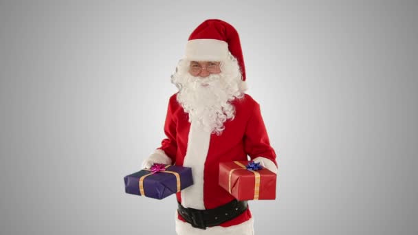 Santa Claus weighting presents, against white – Stock-video