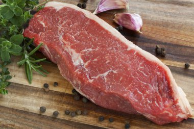 Raw Sirloin Steak with Herbs clipart