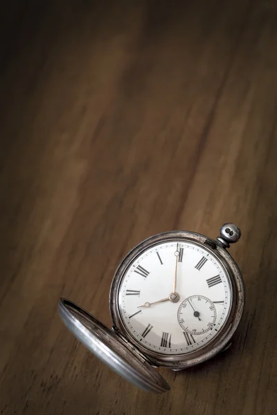 Vintage Pocket Watch over Grunge Timber Royalty Free Stock Photos