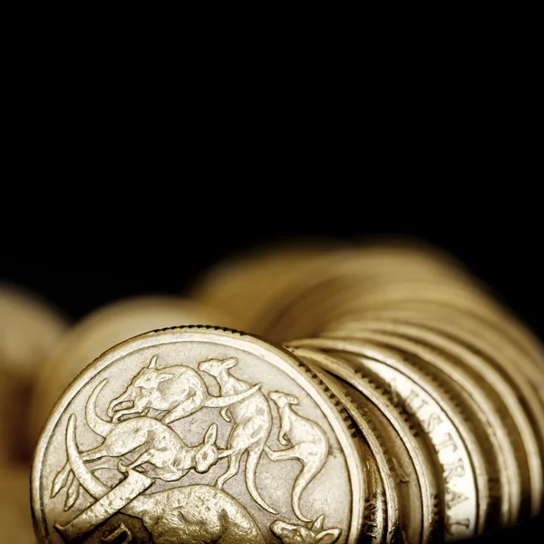 Australian One Dollar Coins over Black — Stock Photo, Image