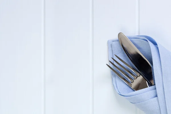 Cutlery in Napkin over Timber Background — Stock Photo, Image