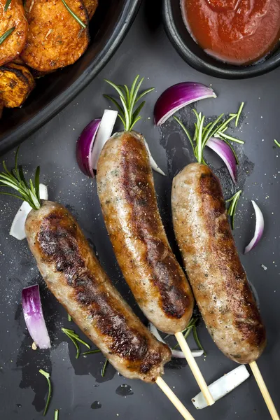Sausages with Rosemary and Sweet Potato Fries — Stock Photo, Image
