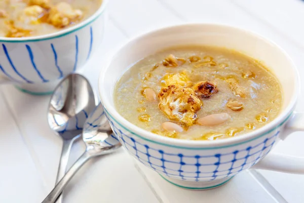 Cauliflower White Bean Soup Two Bowls Spoons Ready Eat Stock Image