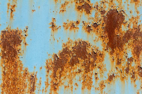 塗料が落ちている錆びた青の金属製の壁 錆びた背景 — ストック写真