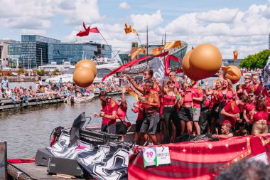 Pride Parade of lesbian, gay, bisexual, transgender, queer and allies. LGBTQ participate in Canal Parade, people in colorful costumes dancing, smiling, boating - Netherlands, Amsterdam, August 6, 2022.