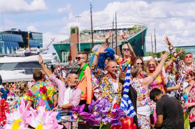 Pride Parade of lesbian, gay, bisexual, transgender, queer and allies. LGBTQ people in colorful costumes dancing, smiling, having fun - Netherlands, Amsterdam, August 6, 2022.