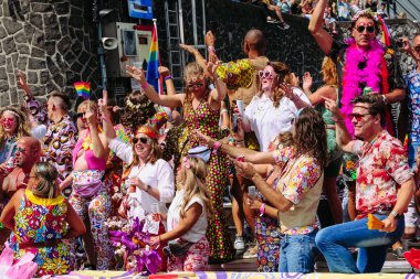 Pride Parade of lesbian, gay, bisexual, transgender, queer and allies. LGBTQ people in colorful costumes dancing, smiling, having fun - Netherlands, Amsterdam, August 6, 2022.