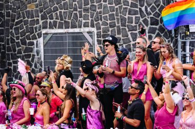 Pride Parade of lesbian, gay, bisexual, transgender, queer and allies. Close up LGBTQ people in colorful costumes dancing, smiling, having fun - Netherlands, Amsterdam, August 6, 2022.
