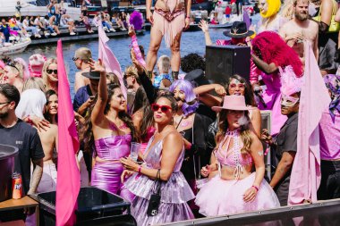People in colorful costumes participate in demonstration for protection of human rights - lesbian, gay, bisexual, transgender, queer Pride Parade in Amsterdam, Netherlands - August 6, 2022.