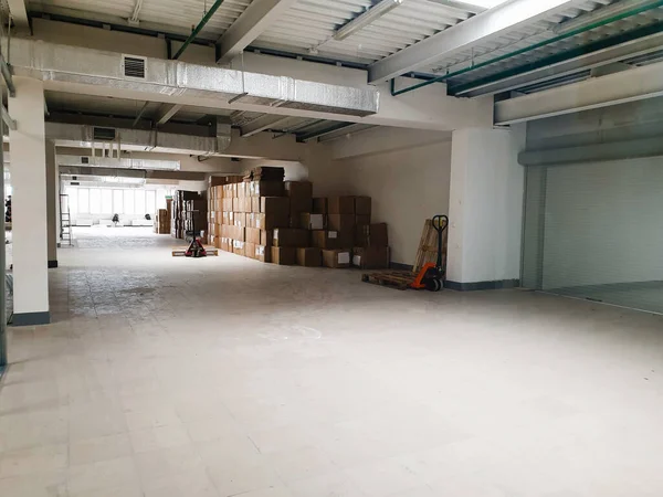 A business or office is moving to a new location. Empty white room with boxes, business is moving to a new space. Renovation and relocation of a new office. Starting a business