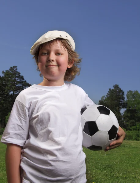 Boy with ball in gate — Stock Photo, Image