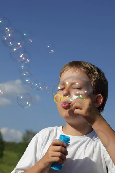 Boy play in bubbles — Stock Photo, Image