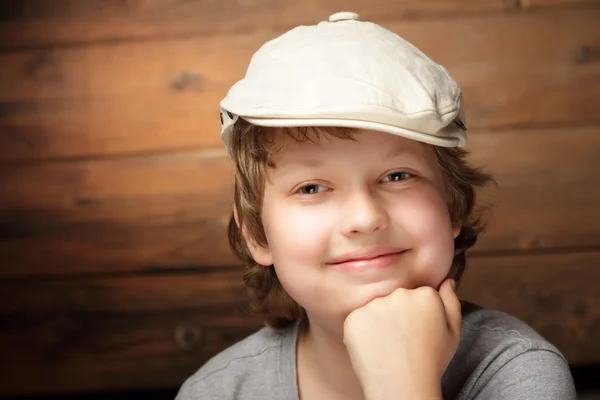 Clever boy on wood background — Stock Photo, Image