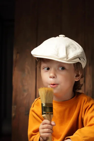 Happy boy with paint brush — Stock Photo, Image