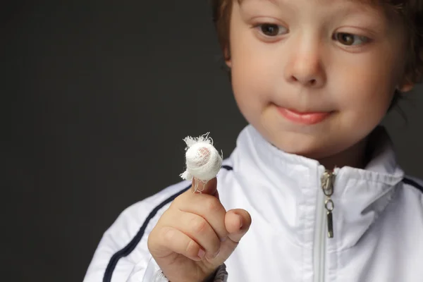 Boy with a wound on his finger — Stock Photo, Image