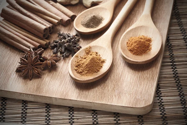 Herbs and Spices over wooden background — Stock Photo, Image