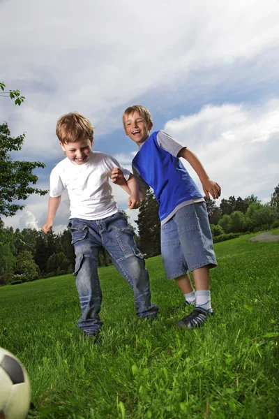 Two happy boy play in soccer — Stock Photo, Image