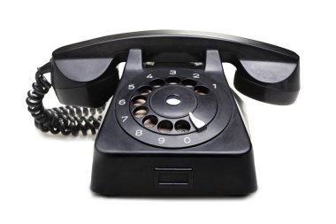 beyaz zemin üzerine eski telefon