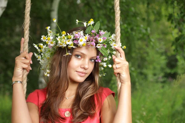 Beauty girl on swing outdoors — Stock Photo, Image