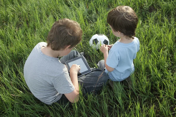 Boy with tablet pc outdoors — Stock Photo, Image
