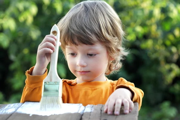 Happy boy with paint brush — Stock Photo, Image