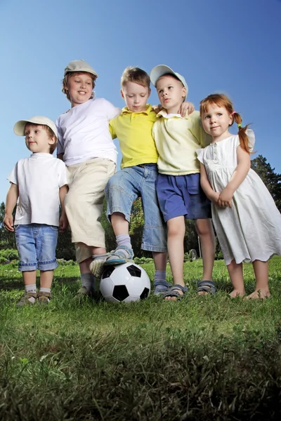 Happy boy and girl play in soccer — Stock Photo, Image