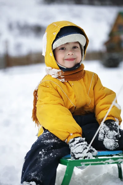 Happy boy on sled — Stock Photo, Image