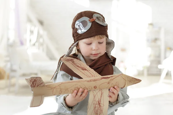 Happy boy with airplane in hand — Stock Photo, Image