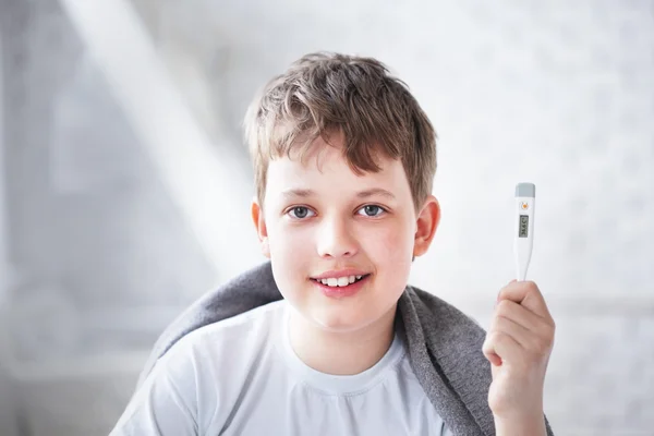 Boy recovered thermometer shows — Stock Photo, Image