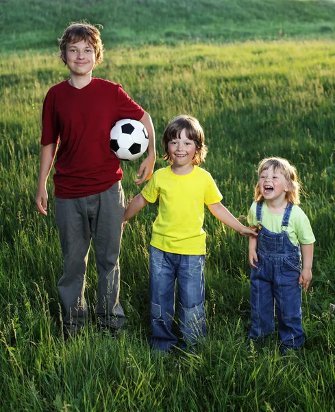 Tree brothers play outdoors — Stock Photo, Image