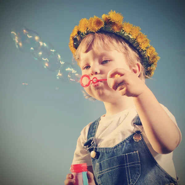 Boy play in  bubbles — Stock Photo, Image