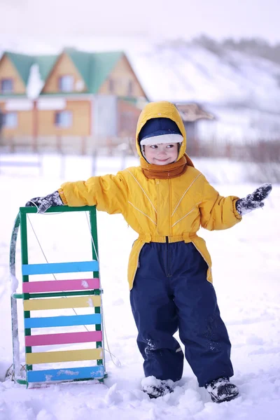 Happy boy with sled — Stock Photo, Image