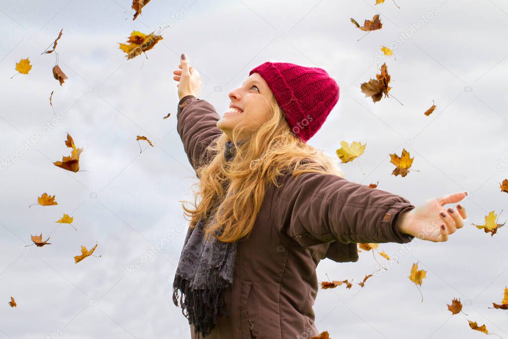 Young, happy woman in autumn