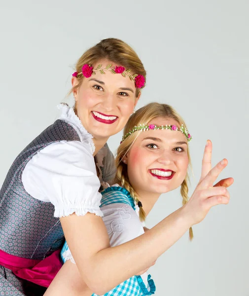 Two Happy Girls Colorful Dirndl Having Fun — ストック写真