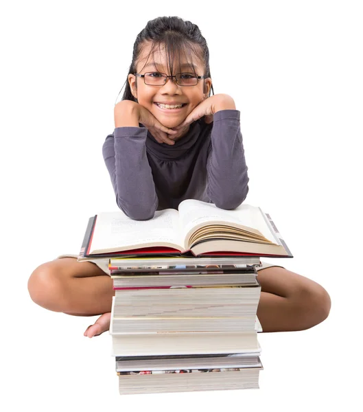 Jonge Aziatische meisje met boeken Stockfoto
