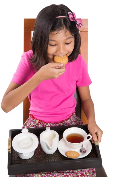 Little Asian girl drinking tea whit pleasure — Stock Photo, Image