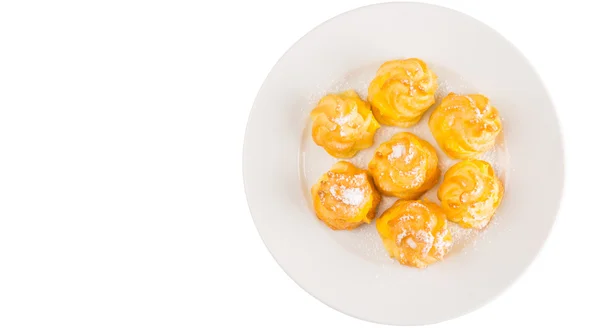 Home made cream puff on a white plate — Stock Photo, Image