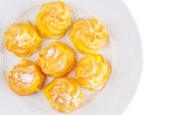 Home made cream puff on a white plate — Stock Photo, Image