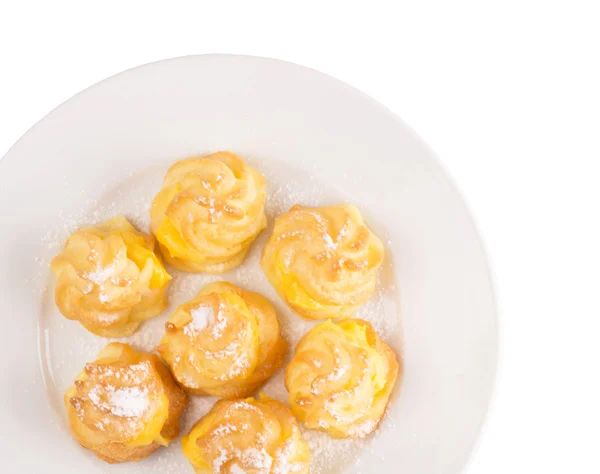 Home made cream puff on a white plate — Stock Photo, Image
