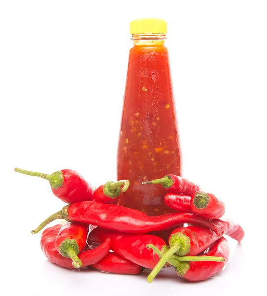 Ketchup bottle and fresh tomatoes — Stock Photo, Image