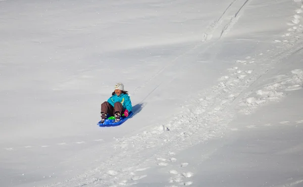 ST CERGUE, NYON, SWITZERLAND, 25th December 2011. A little girl enjoying ride — Stock Photo, Image