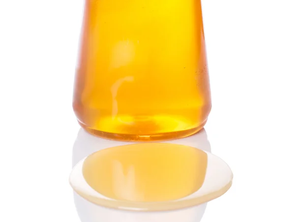 Een fles van natuurlijke honing — Stockfoto