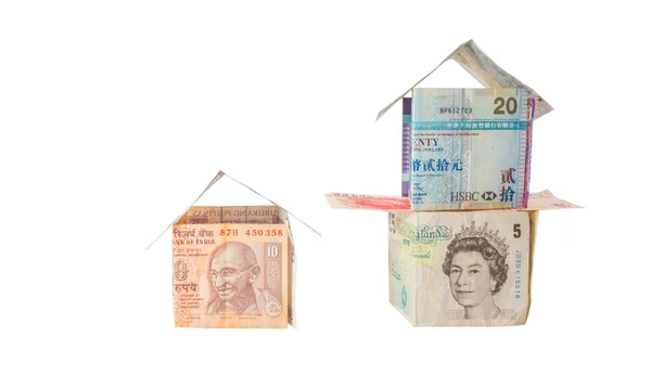 Huizen gemaakt van valuta 's — Stockfoto