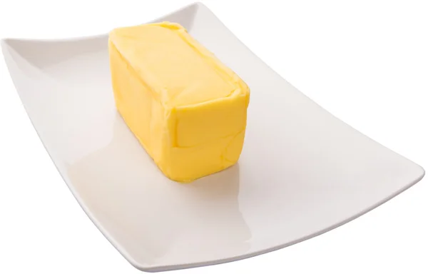 Butter auf weißem Hintergrund — Stockfoto