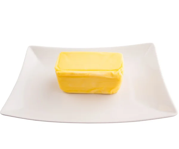 Manteiga sobre fundo branco — Fotografia de Stock