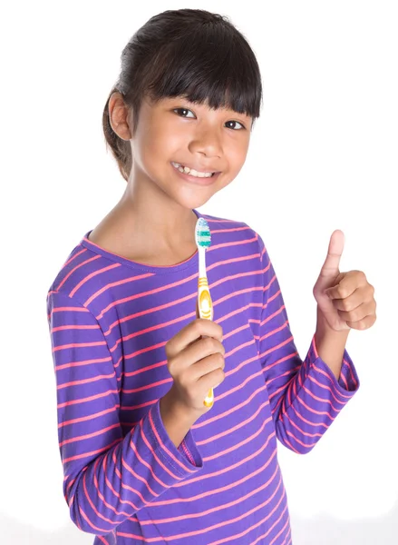 Chica joven con cepillo de dientes —  Fotos de Stock