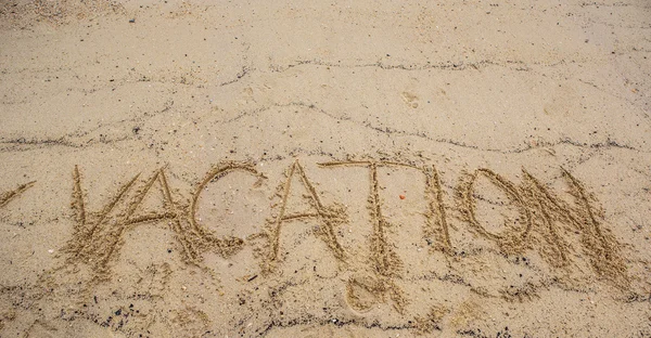 Palabra de vacaciones en la arena — Foto de Stock