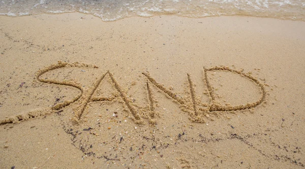 Playa con palabra SAND — Foto de Stock